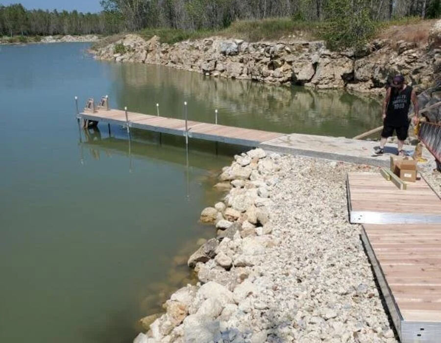 Rock riprap and dock installation along a shoreline