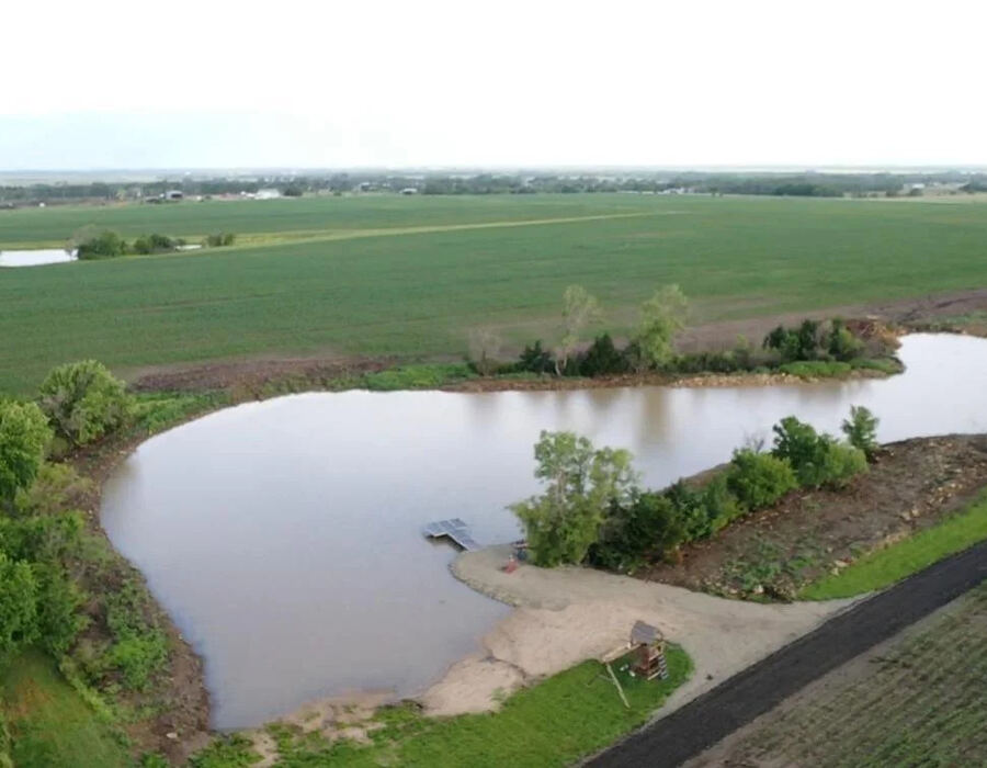 Aerial view of a completed farm pond excavation project