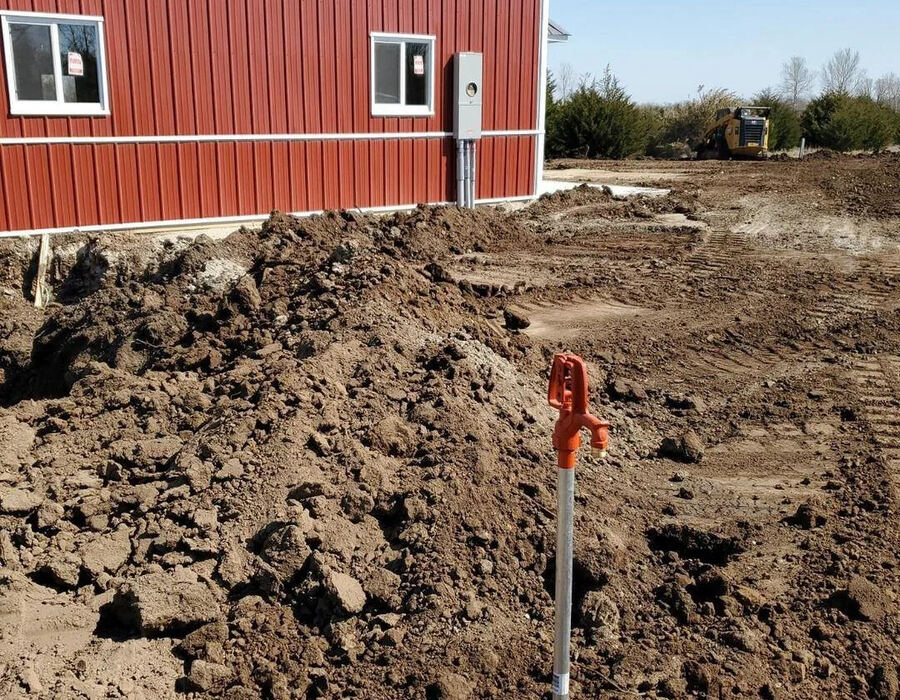 Site grading and dirt work next to a new building in Butler County, KS